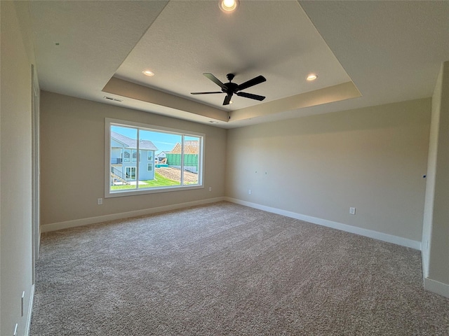1258 S 92nd St, West Des Moines, IA 50266 - carpeted empty room featuring a tray ceiling, recessed lighting, and ceiling fan