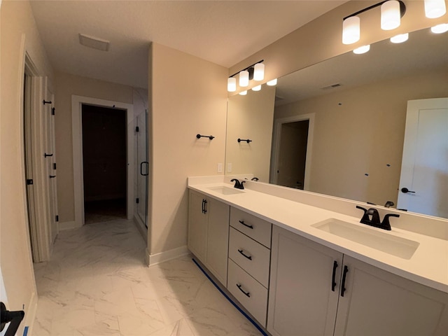 1258 S 92nd St, West Des Moines, IA 50266 - bathroom with marble look tile flooring, double vanity, and a shower stall