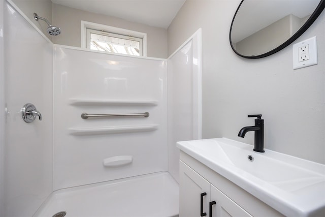 full bath with walk in shower and vanity