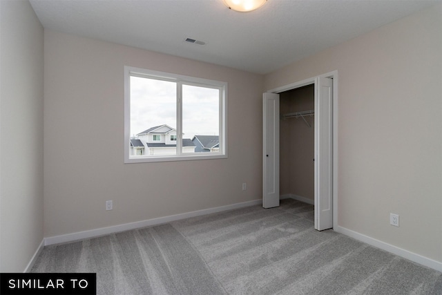 4312 NE 8th St, Ankeny, IA 50021 - unfurnished bedroom with baseboards, visible vents, carpet floors, and a closet