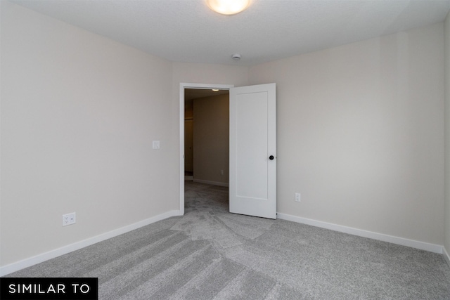 4312 NE 8th St, Ankeny, IA 50021 - empty room featuring carpet flooring and baseboards