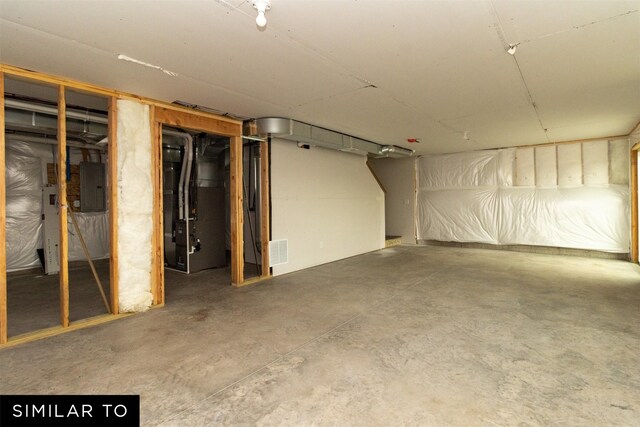 4312 NE 8th St, Ankeny, IA 50021 - unfinished below grade area with visible vents, heating unit, and electric panel