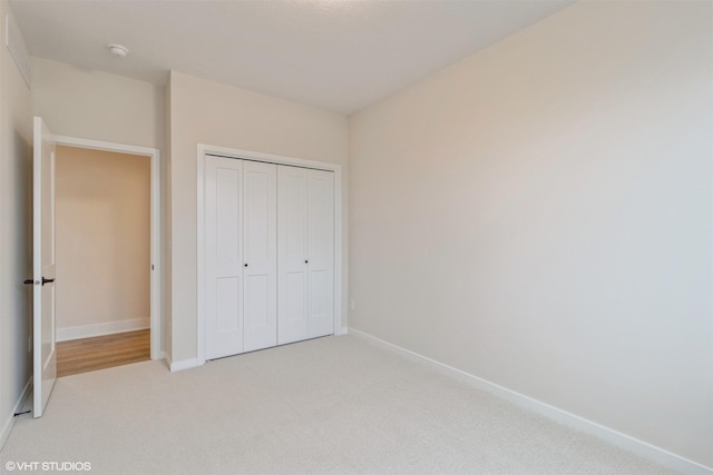 4308 NE 8th St, Ankeny, IA 50021 - unfurnished bedroom featuring baseboards, a closet, and light colored carpet
