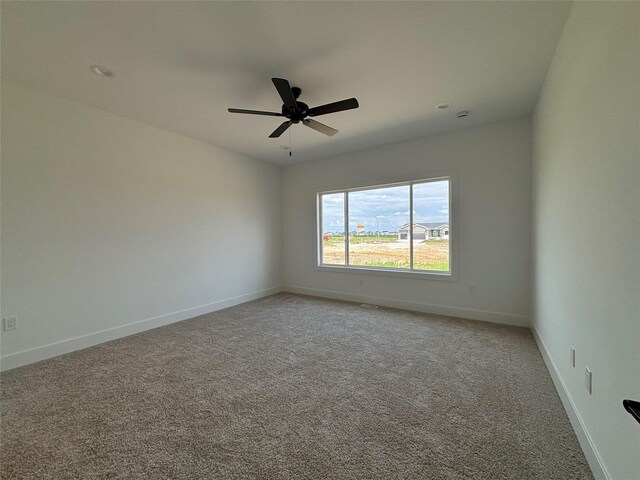 4655 178th St, Urbandale, IA 50263 - spare room with light carpet, baseboards, and ceiling fan