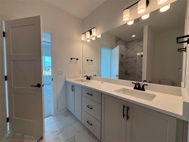 4655 178th St, Urbandale, IA 50263 - full bath with marble finish flooring, a stall shower, double vanity, toilet, and baseboards