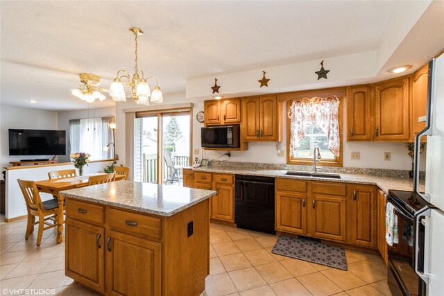 9601 NE 28th Ct, Ankeny, IA 50021 - kitchen featuring light tile patterned floors, brown cabinetry, a sink, and black appliances