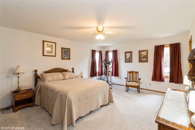 9601 NE 28th Ct, Ankeny, IA 50021 - bedroom featuring light carpet, a ceiling fan, and baseboards