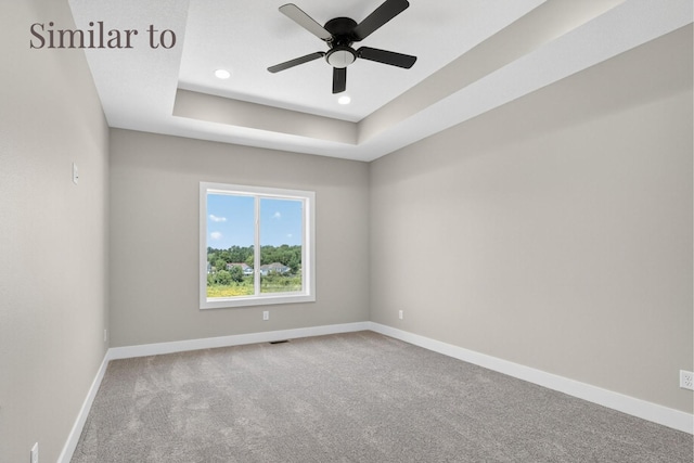 2934 Lake Hill Dr, Des Moines, IA 50320 - empty room featuring carpet floors, ceiling fan, recessed lighting, and a raised ceiling