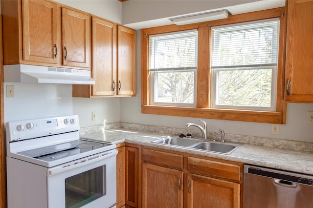 kitchen featuring electric stove, a sink, dishwasher, light countertops, and under cabinet range hood