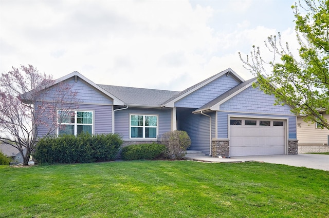 view of front of property with an attached garage, stone siding, a front lawn, and driveway