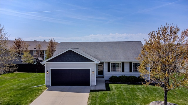 10308 Catalina Dr, Johnston, IA 50131 - view of front of house featuring a garage, a front lawn, driveway, and roof with shingles