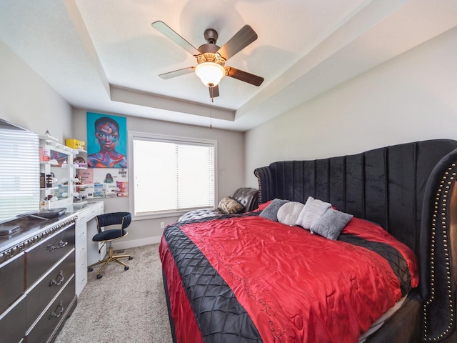 1110 NE 15th Ln, Ankeny, IA 50021 - carpeted bedroom featuring a ceiling fan, baseboards, and a raised ceiling