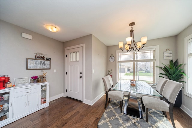 1110 NE 15th Ln, Ankeny, IA 50021 - dining space with dark wood-style flooring, baseboards, and a notable chandelier