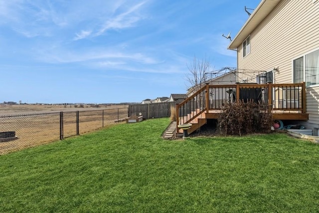 717 37th St SW, Bondurant, IA 50035 - view of yard featuring a wooden deck, a fenced backyard, and stairs