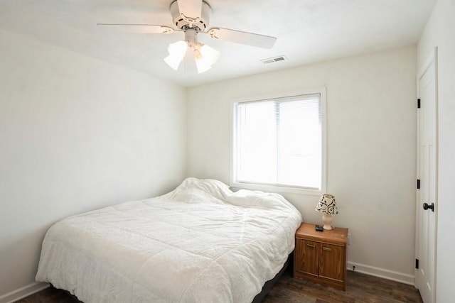 717 37th St SW, Bondurant, IA 50035 - bedroom featuring ceiling fan, baseboards, dark wood-type flooring, and visible vents