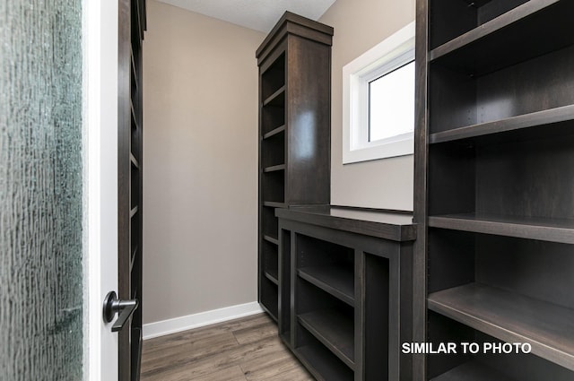 530 Walnut Dr, Huxley, IA 50124 - walk in closet featuring wood finished floors