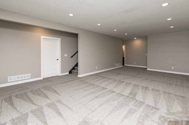 530 Walnut Dr, Huxley, IA 50124 - carpeted spare room featuring recessed lighting and stairs