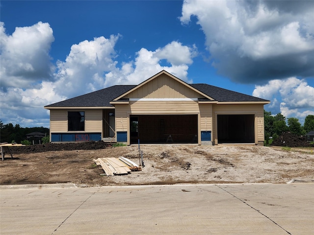 530 Walnut Dr, Huxley, IA 50124 - unfinished property featuring an attached garage, driveway, and roof with shingles