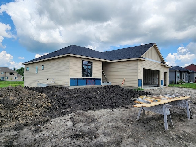 530 Walnut Dr, Huxley, IA 50124 - view of property exterior featuring an attached garage and board and batten siding