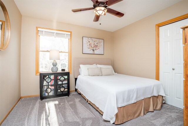 748 76th St, West Des Moines, IA 50266 - carpeted bedroom featuring baseboards and a ceiling fan