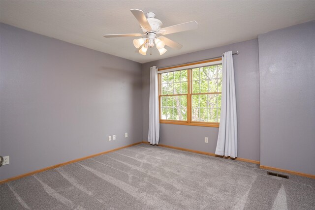 748 76th St, West Des Moines, IA 50266 - empty room featuring baseboards, a ceiling fan, and carpet floors