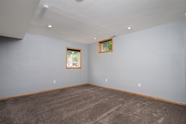 748 76th St, West Des Moines, IA 50266 - spare room featuring carpet flooring, recessed lighting, baseboards, a textured ceiling, and a smoke detector
