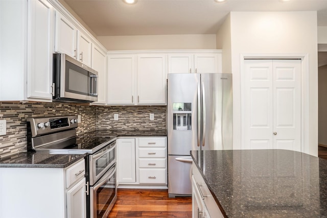 748 76th St, West Des Moines, IA 50266 - kitchen with stainless steel appliances, white cabinets, dark wood-style floors, tasteful backsplash, and recessed lighting