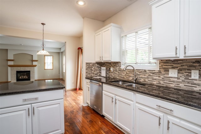 748 76th St, West Des Moines, IA 50266 - kitchen with stainless steel dishwasher, a sink, white cabinetry, decorative backsplash, and recessed lighting