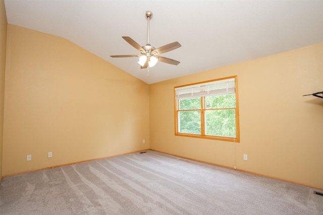748 76th St, West Des Moines, IA 50266 - empty room with vaulted ceiling, a ceiling fan, light colored carpet, and baseboards