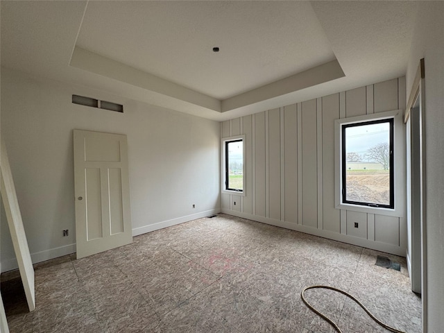 6633 River Bend Dr, Johnston, IA 50131 - empty room with baseboards and a raised ceiling