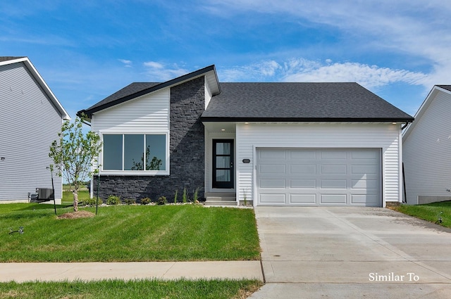 view of front of property featuring a front lawn, central AC, driveway, stone siding, and a garage