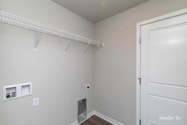 washroom featuring hookup for an electric dryer, laundry area, baseboards, washer hookup, and dark wood-type flooring