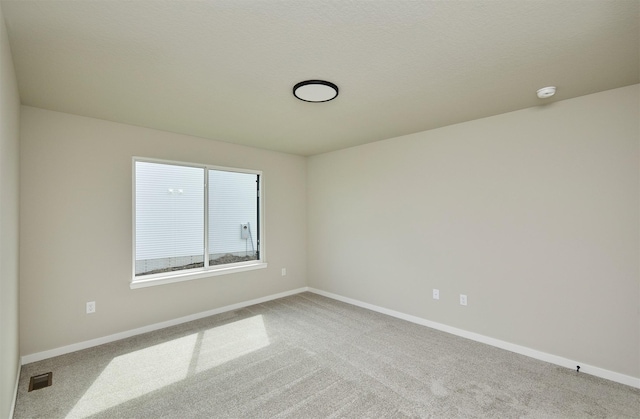 635 NW Compass Ave, Waukee, IA 50263 - carpeted empty room with a smoke detector and baseboards