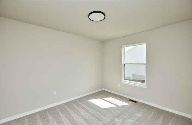 635 NW Compass Ave, Waukee, IA 50263 - spare room with carpet floors and baseboards