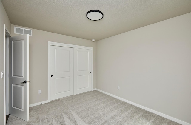 635 NW Compass Ave, Waukee, IA 50263 - unfurnished bedroom with light colored carpet and a closet