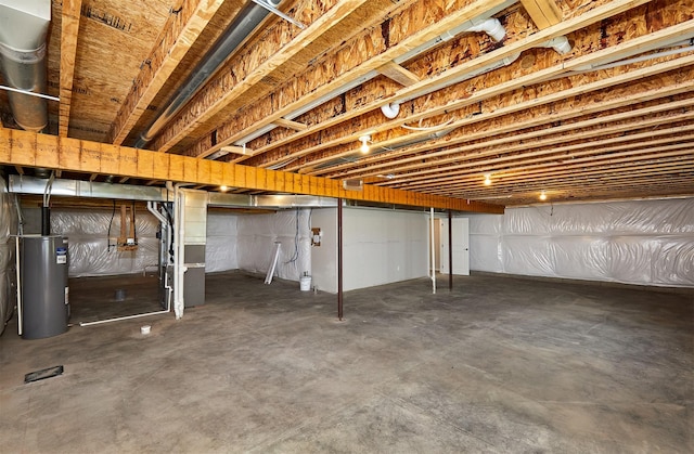 635 NW Compass Ave, Waukee, IA 50263 - unfinished basement featuring water heater