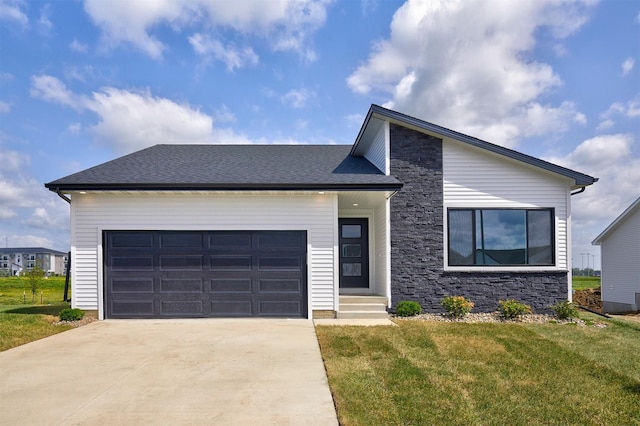 635 NW Compass Ave, Waukee, IA 50263 - view of front of home featuring driveway, a front yard, an attached garage, and stone siding