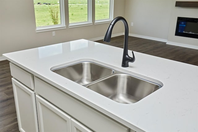 635 NW Compass Ave, Waukee, IA 50263 - kitchen view of dark wood-type flooring and light countertops