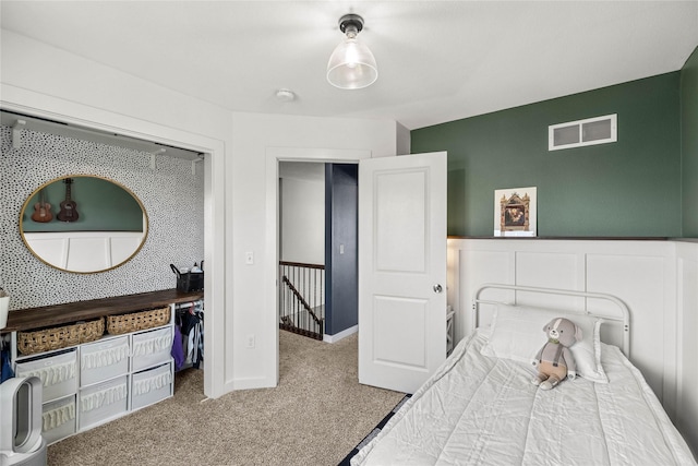 bedroom featuring visible vents and carpet flooring