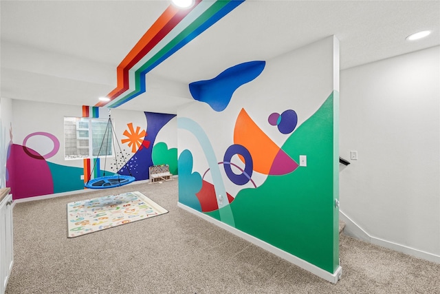 recreation room with recessed lighting, baseboards, and carpet