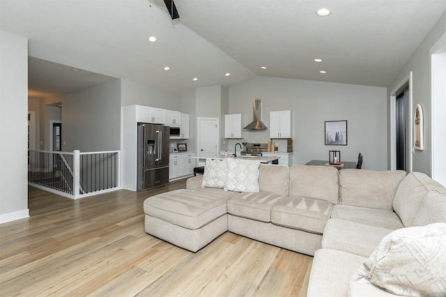 1040 W Trace Pl, Polk City, IA 50226 - living room featuring recessed lighting, vaulted ceiling, and light wood-type flooring