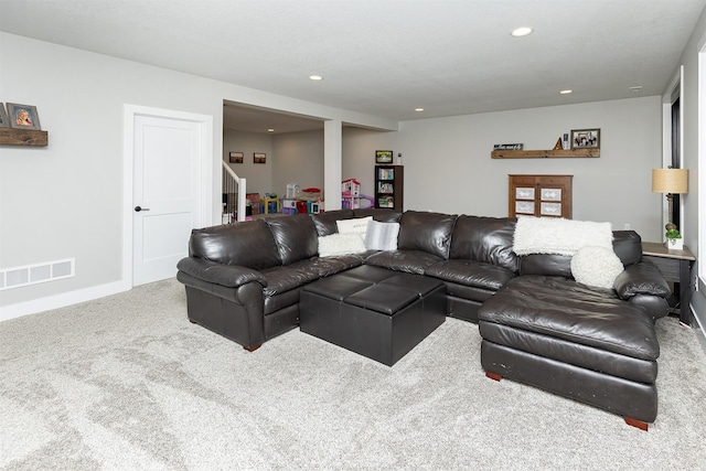 1040 W Trace Pl, Polk City, IA 50226 - living area featuring carpet floors, stairs, visible vents, and recessed lighting
