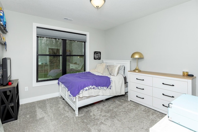 1040 W Trace Pl, Polk City, IA 50226 - carpeted bedroom featuring baseboards and visible vents