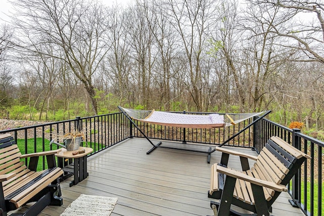 1040 W Trace Pl, Polk City, IA 50226 - wooden terrace featuring a forest view