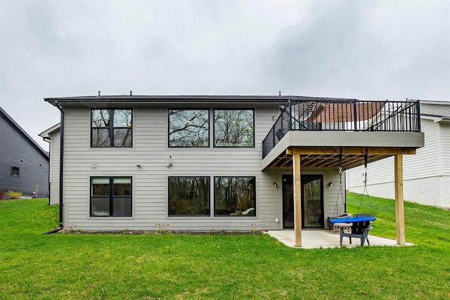 1040 W Trace Pl, Polk City, IA 50226 - back of property with a deck, a yard, and a patio