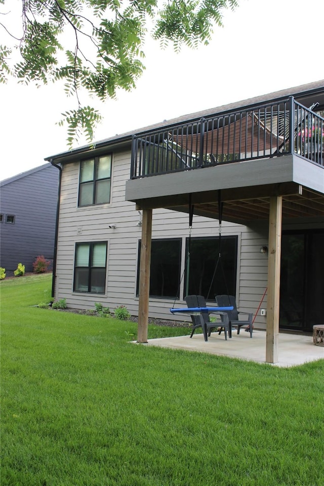 1040 W Trace Pl, Polk City, IA 50226 - back of house with a patio area, a yard, and a balcony