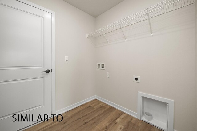 16514 Ironwood Ln, Urbandale, IA 50323 - laundry room with hookup for a washing machine, baseboards, wood finished floors, and hookup for an electric dryer