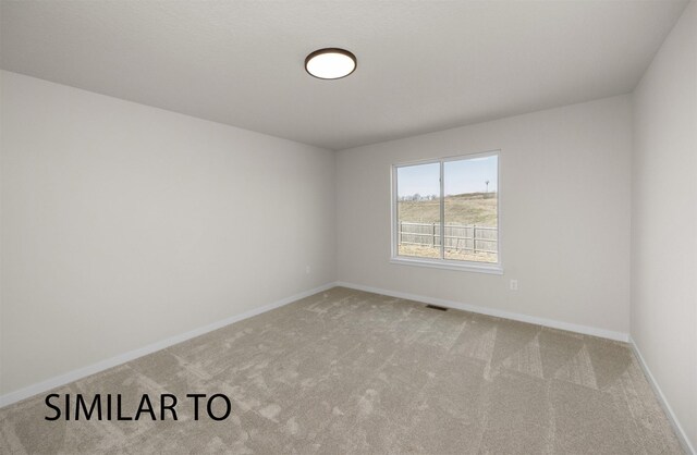 16514 Ironwood Ln, Urbandale, IA 50323 - carpeted empty room with baseboards