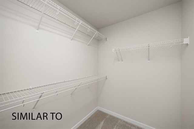 16514 Ironwood Ln, Urbandale, IA 50323 - spacious closet featuring carpet flooring