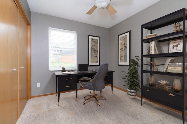office area featuring ceiling fan, carpet, and baseboards